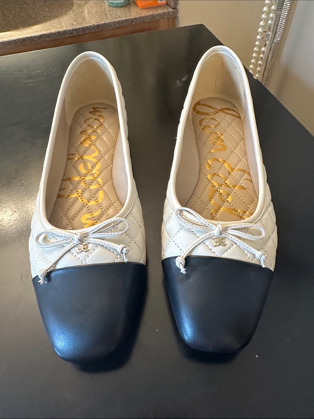 Quilted Cream and Black Cap-Toe Ballet Flats with Bow